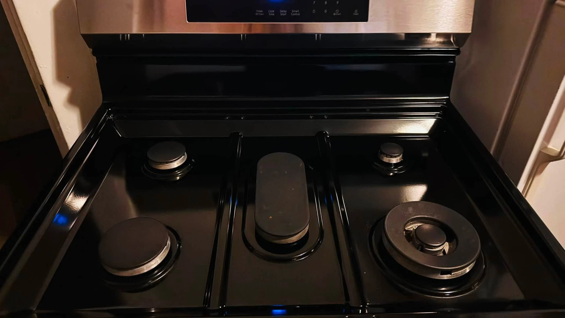 Close-up of a stovetop polished to a spotless finish