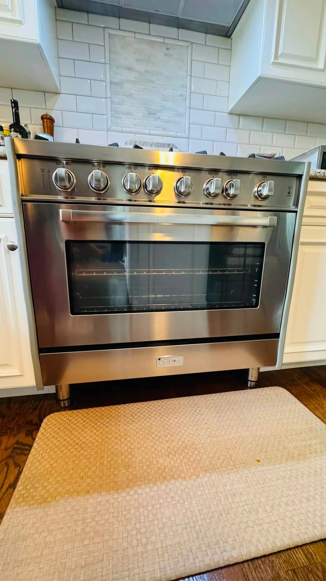 Polished stainless range in a clean kitchen